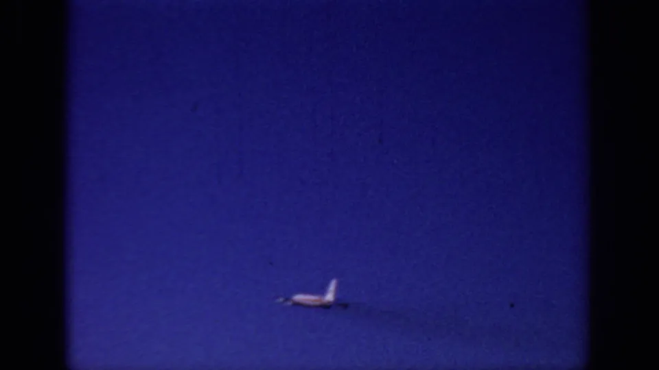 The jet has become a small shape against the blue Sacramento sky as the 1966 home-movie takeoff shot ends.