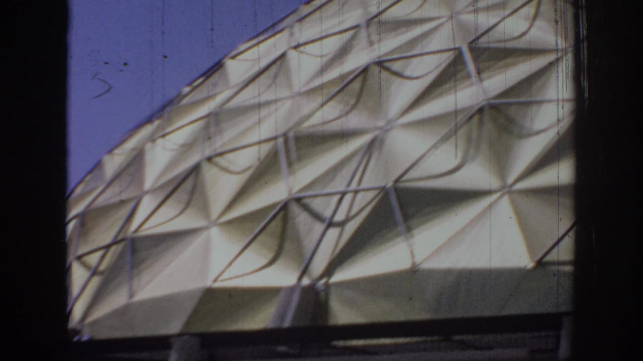 Close view of the dome's triangular geometric panel pattern.
