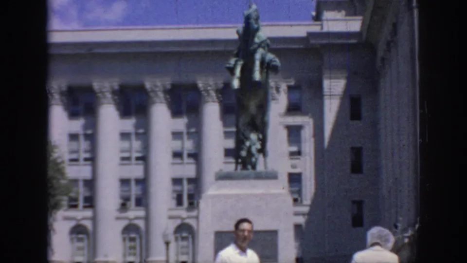 A 1967 Oklahoma frame holds on the equestrian monument while adults in summer clothing move through the lower foreground.