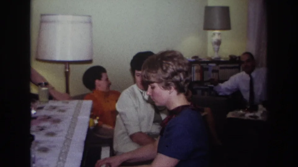 1967 Rockaway Beach frame with the pianist in profile and several adults seated behind her in a domestic interior.