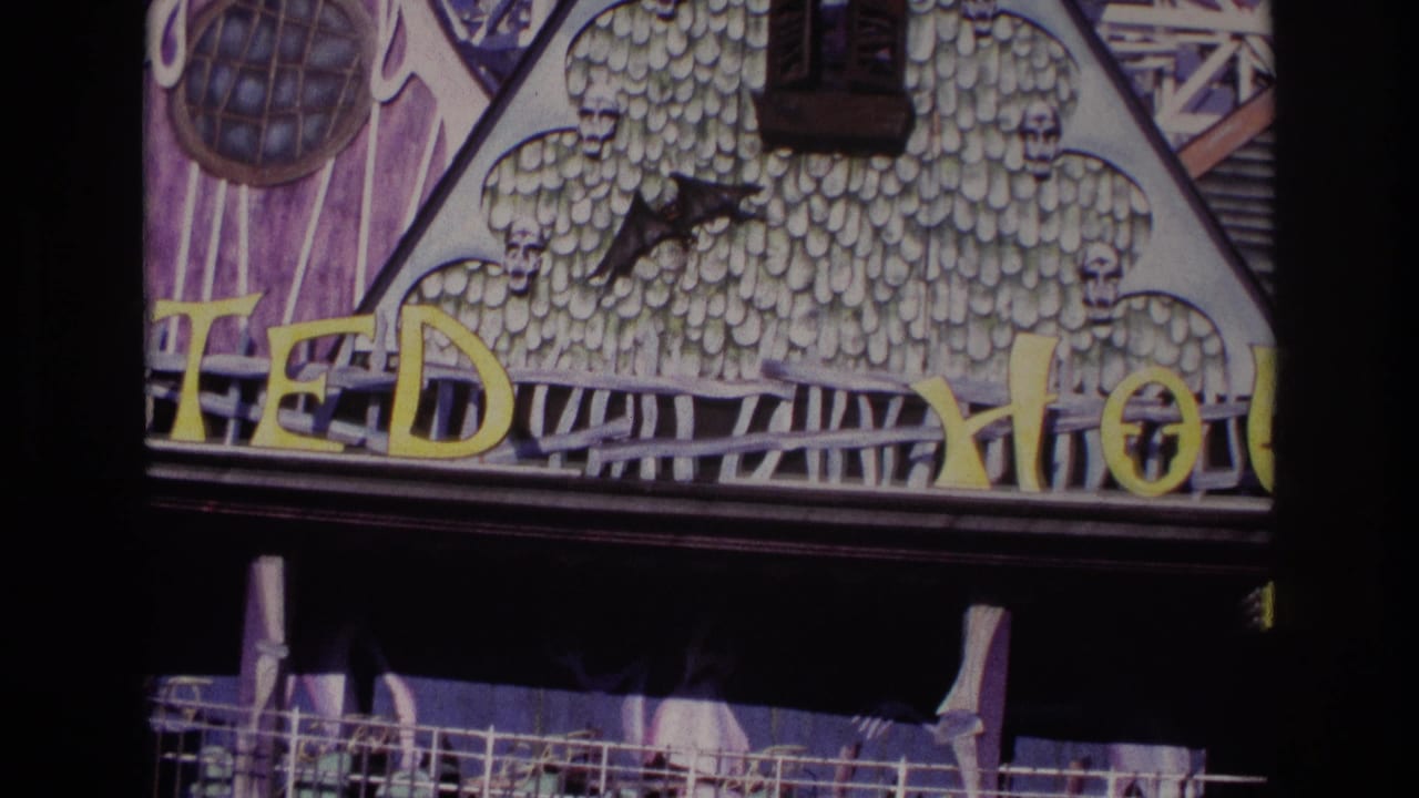 Rockaway Beach 1967 frame with the TEDDY HOUSE sign, gothic facade details, dark awning, and a glimpse of railing below.