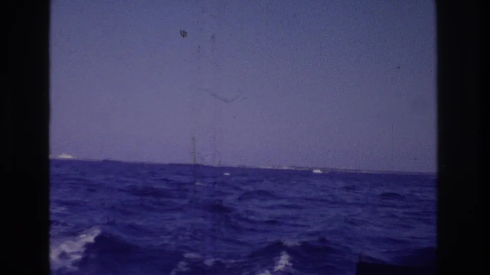 1968 Ocean City, New Jersey home-movie view from a boat, showing blue choppy water, low horizon, and distant land.