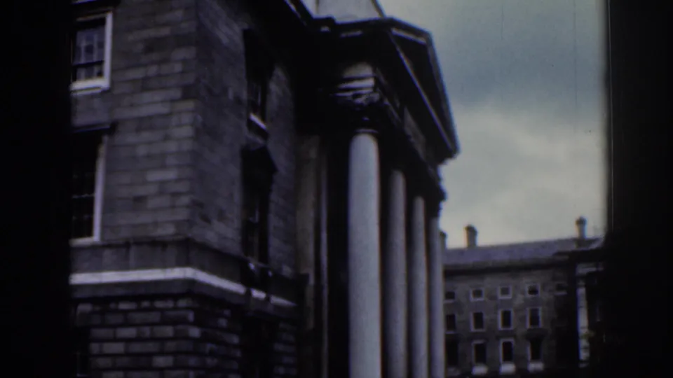 1961 Dublin frame with a columned stone portico in the foreground and a courtyard building visible beyond.