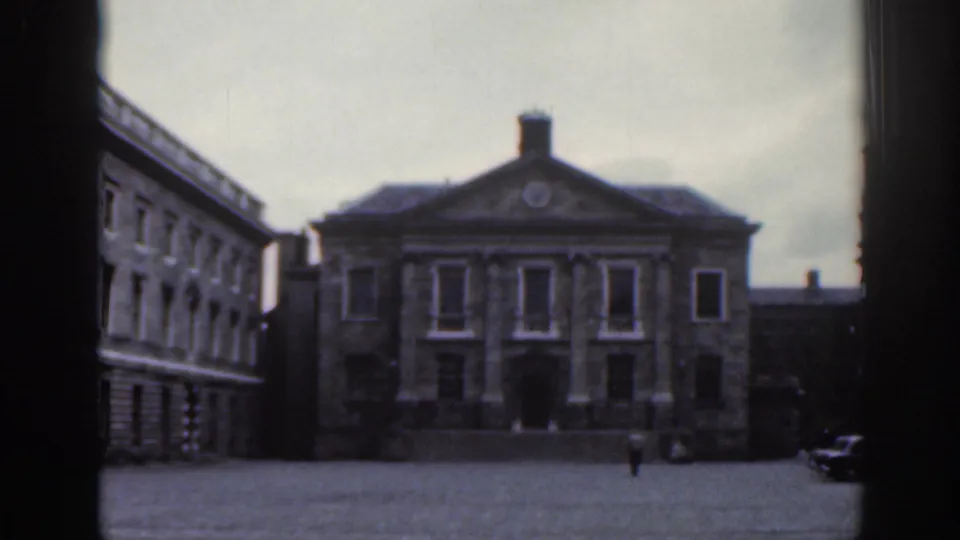 1961 Dublin view of a formal stone building with a pediment across a mostly empty public square.