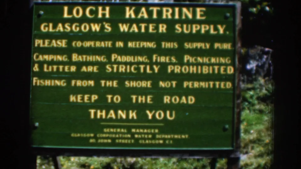 1961 Scotland frame centered on the Loch Katrine water-supply sign, with rules about keeping the supply pure and staying to the road.