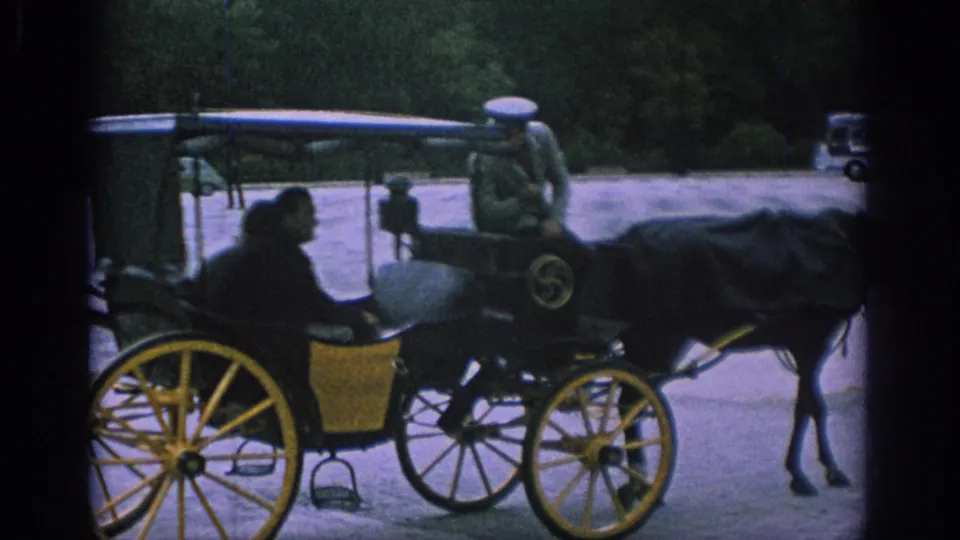 In the 1966 Spain footage, a passenger sits in a horse-drawn carriage with yellow wheels while the coachman faces forward.
