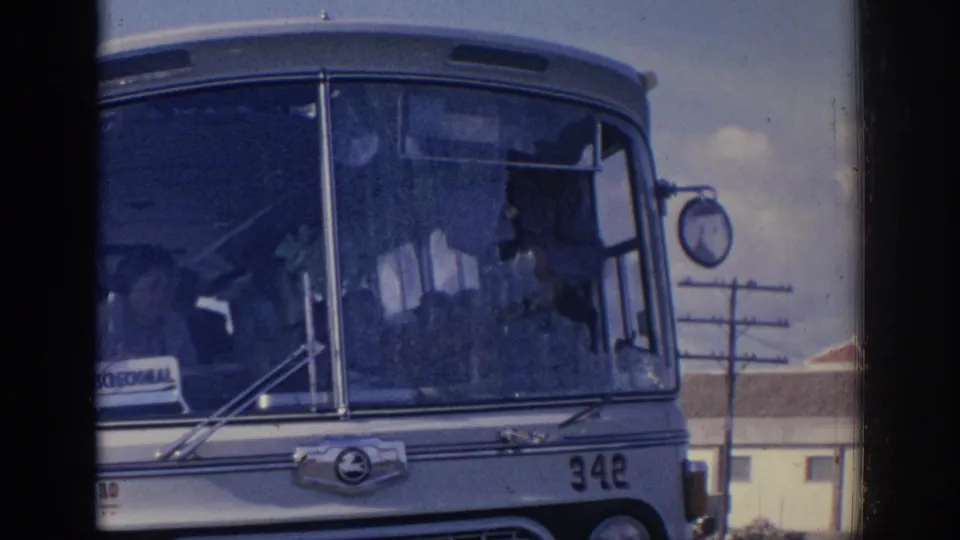 1966 Spain 8mm frame showing a close front view of bus number 342, cracked windshield glass, and a REGIONAL placard on the dashboard.