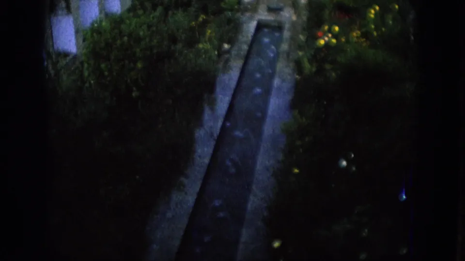 Final 1966 Spain still showing the historic courtyard water channel running through planted greenery beside arched architecture.