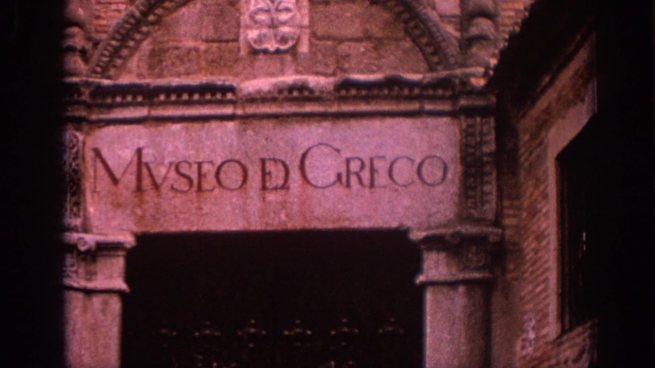 Visitor-shot 8mm view of the Museo del Greco inscription over a dark entrance, with carved masonry visible around it.