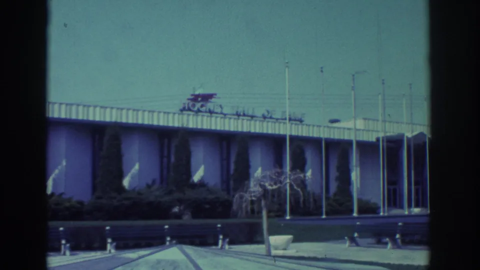1972 Toronto view of the Hockey Hall of Fame building facade, showing the roof sign, flagpoles, walkway, and landscaping.