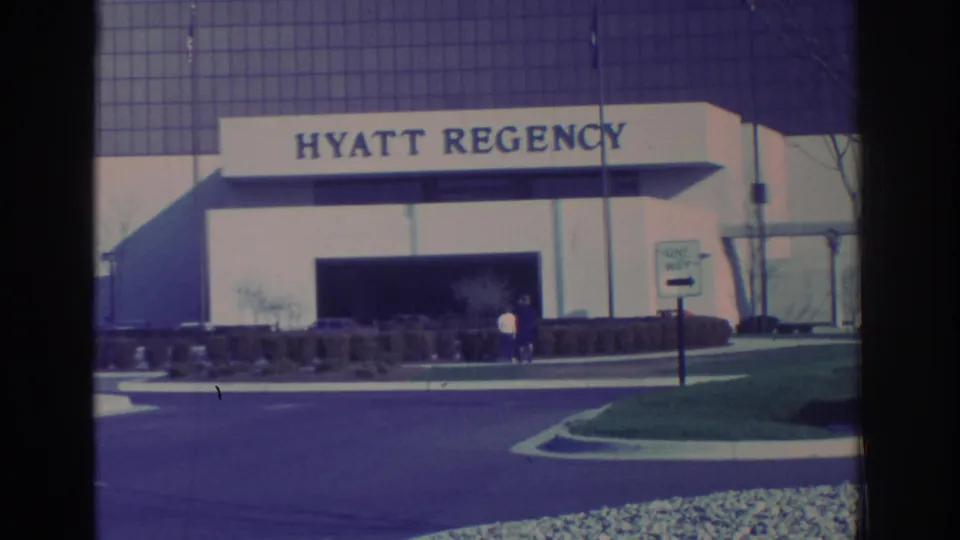 1972 Toronto hotel exterior with prominent Hyatt Regency signage, drop-off drive, landscaping, and people near the entrance.