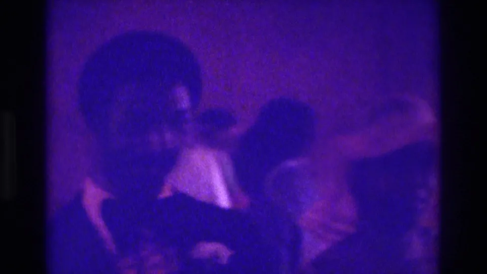 The final frame shows a suited man in the foreground, a guest in a light shirt, and a woman at right during the 1975 Atlanta wedding.