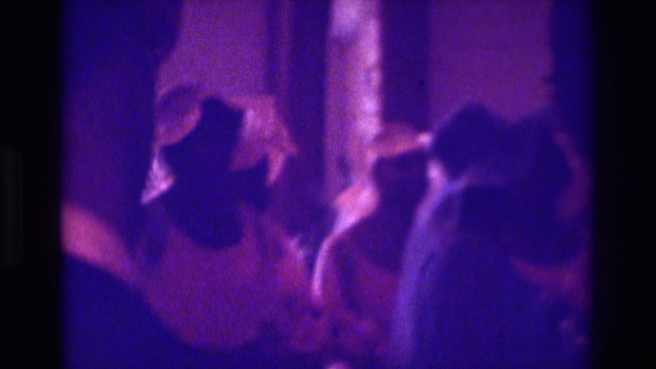 Two purple-tinted views of wedding guests divided by a dark film frame edge.