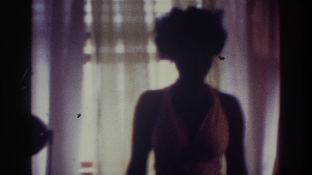 Silhouetted woman near curtains with one shoulder and swimsuit outline visible.