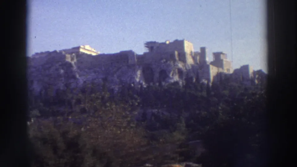 8mm view of the Acropolis rock and temple ruins from ground level, Athens, Greece, circa 1976.