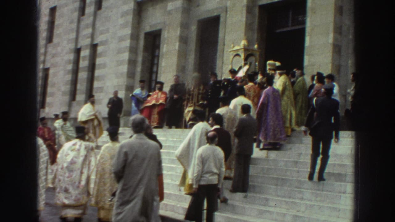 Mixed group of clergy in red, purple, and gold vestments ascending stone steps toward a church doorway, Greece, circa 1976.