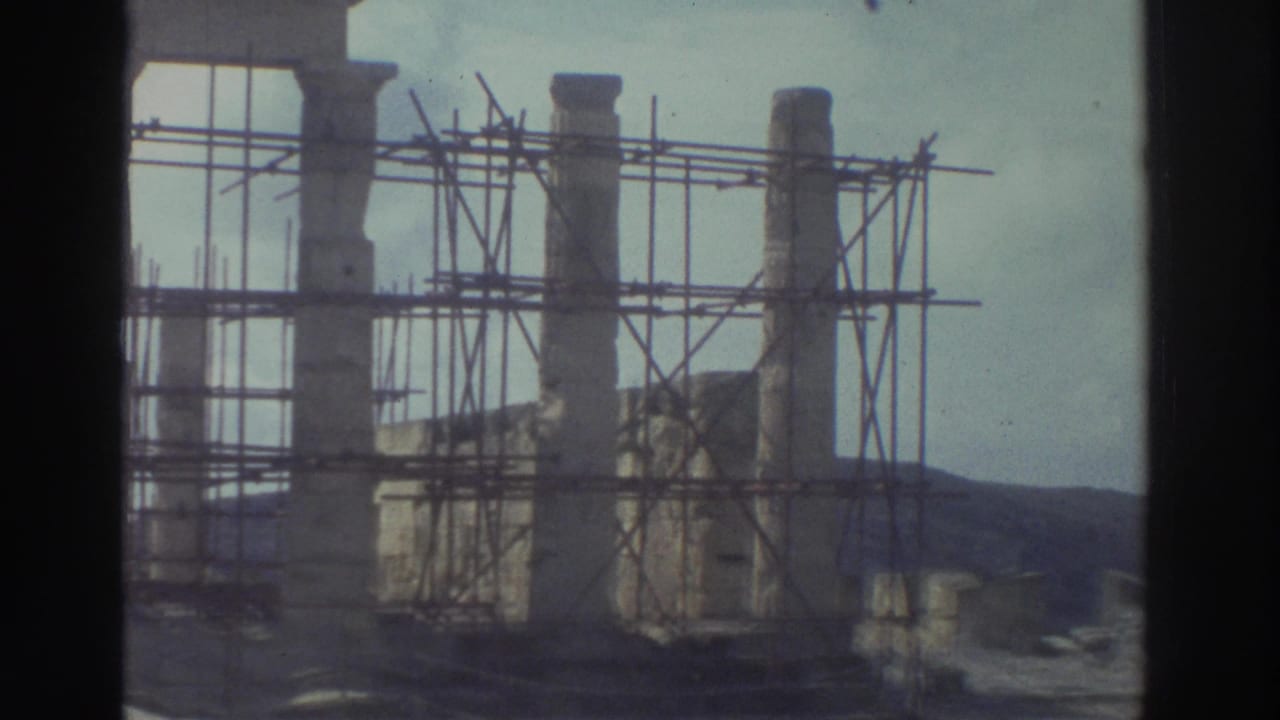A second view of Greek stone ruins with scaffolding, framed by the dark edge of the 8mm contact-sheet scan.