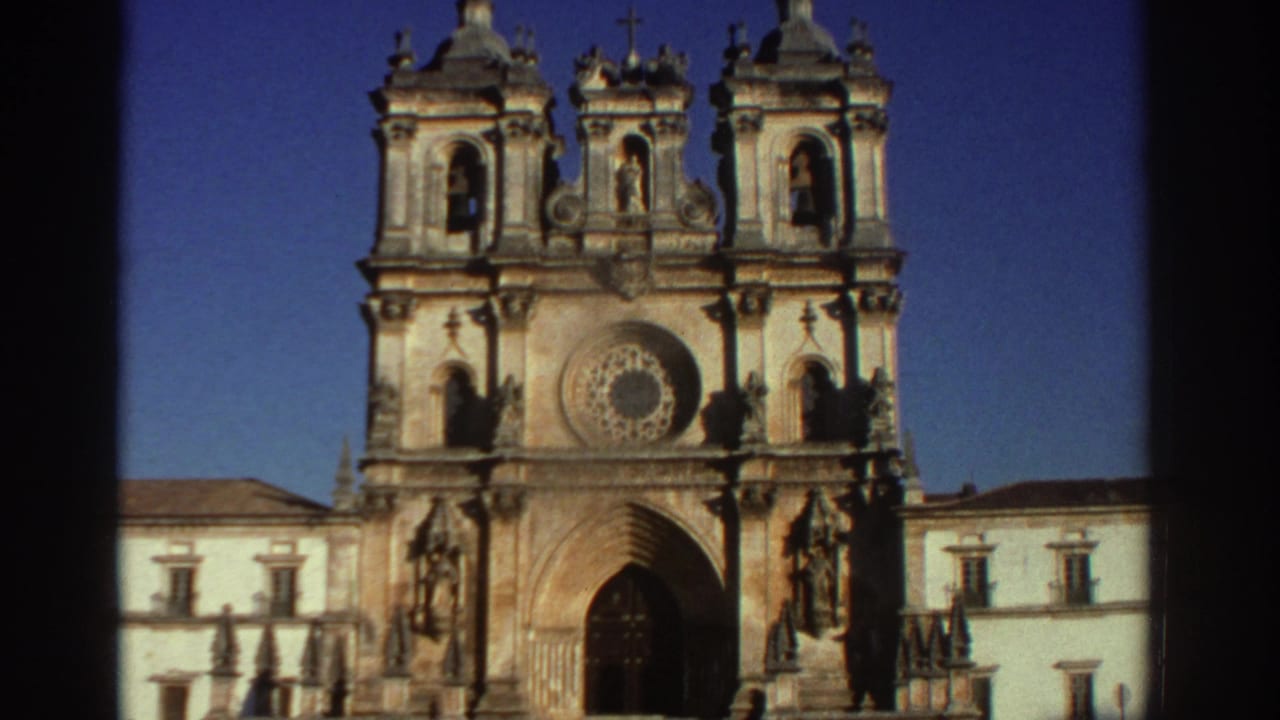 Ornate cathedral facade with twin bell towers, rose window, and arched entrance.
