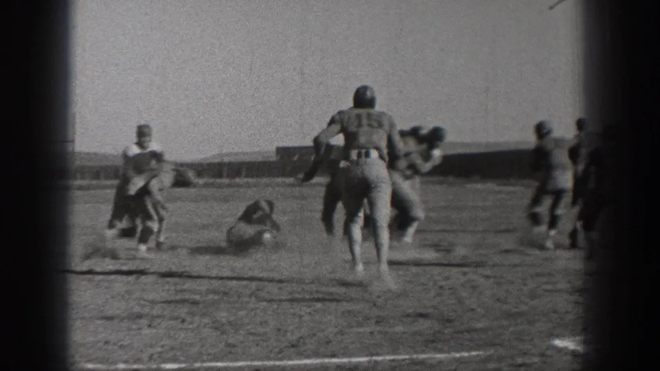 1938 Washington football action shows a runner moving upfield while other players tackle or fall behind him.