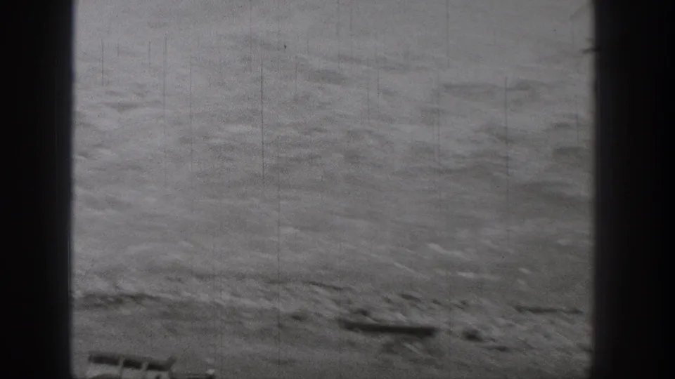 Close view of fast-moving river or spillway water in the 1938 Washington construction sequence.