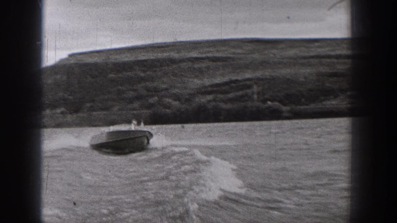 The motorboat passes near the lower frame of the 1938 Washington lake scene, with open water, wake, and a broad hillside shoreline behind.