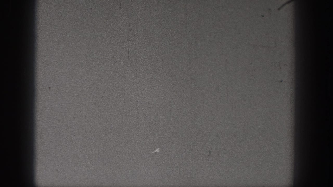 Lower contact-sheet frame from the 1938 Washington 8mm scan, showing gray film texture, dark borders, and surface wear.