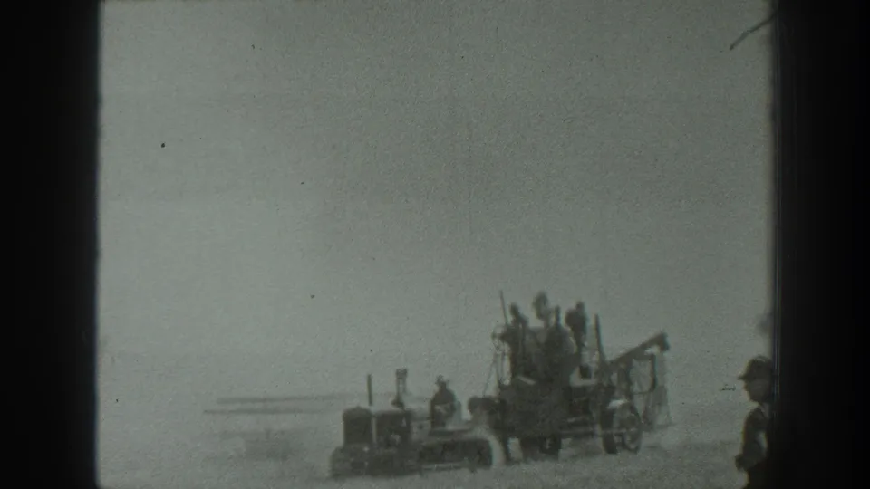 The final frame shows the tractor and farm implement farther off in the dusty field, with men aboard and a partial person at the right edge.