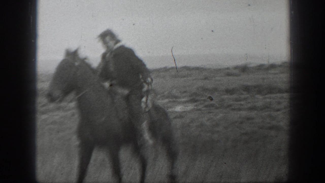 1939 Montana 8mm frame showing a man on horseback moving through a wide rural field.