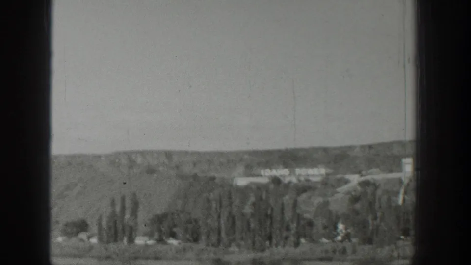 A final moving view shows IDAHO POWER lettering beyond sparse trees and dry foreground terrain in the Wyoming travel sequence.