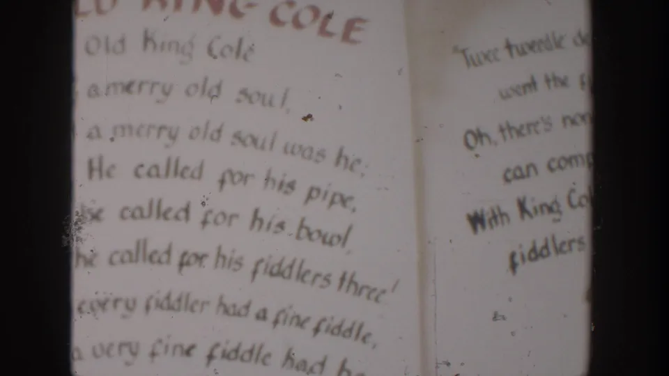 Hand-lettered Old King Cole wording appears beside a partial second text panel in this 1954 Wisconsin Dells home-movie frame.