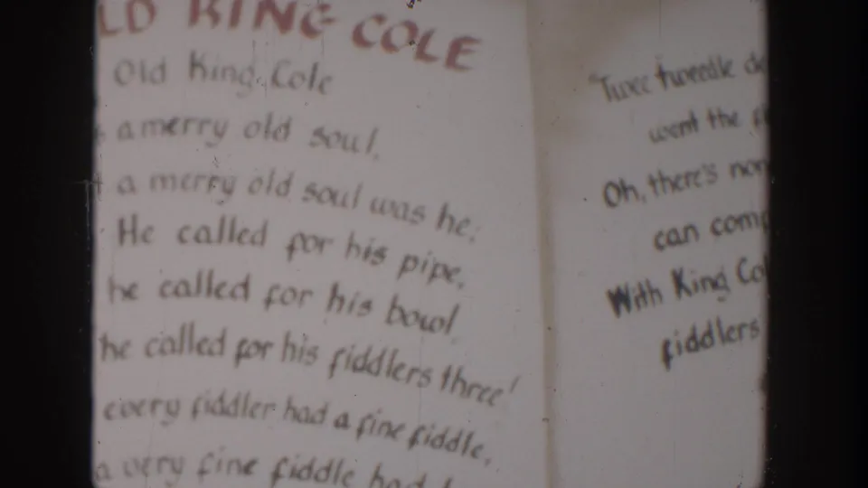 Another 1954 Wisconsin Dells frame of the Old King Cole rhyme page, with soft focus, dust marks, and heavy gate framing.