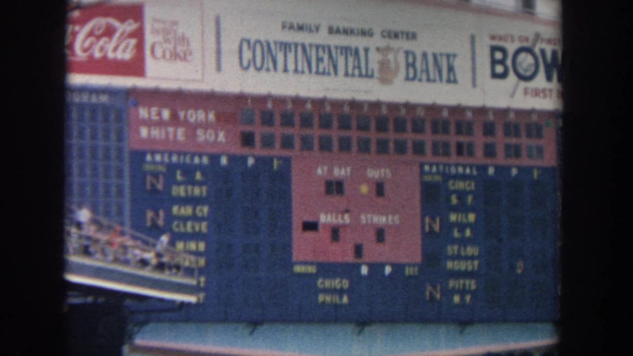Scoreboard and stadium seating with spectators and team names visible.