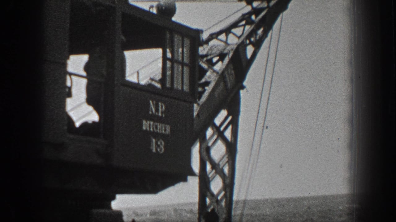 Side view of the N.P. DITCHER 13 crane cab and lattice boom over an open California field in 1936 footage.