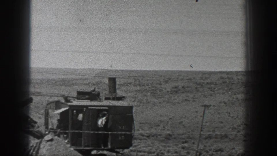1936 California desert footage showing a steam-powered industrial machine at a distance, with an operator visible in the cab.