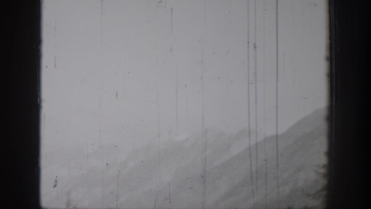 Black-and-white 1939 Chelan-area mountain view, partially obscured by a dark window or film-frame edge.