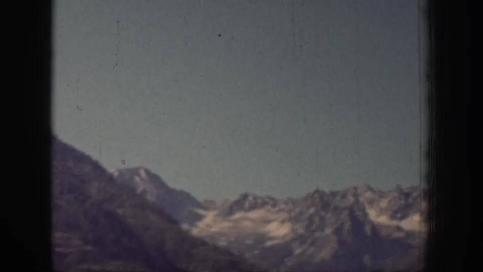 A wide view of snow-dusted mountain ridges and pale sky closes the brief Chelan, Washington scenery shot.