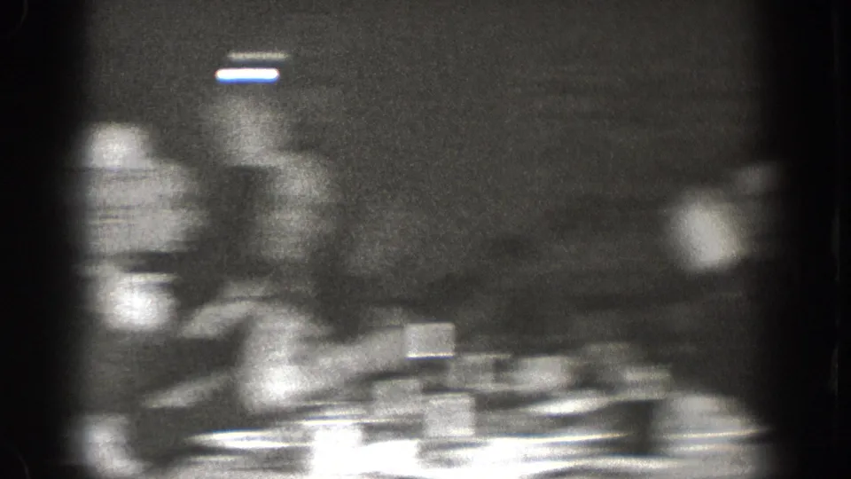 Final frame of Chelan, Washington 1939 8mm footage rendered largely indistinct by motion blur; dining table and cups partially visible.