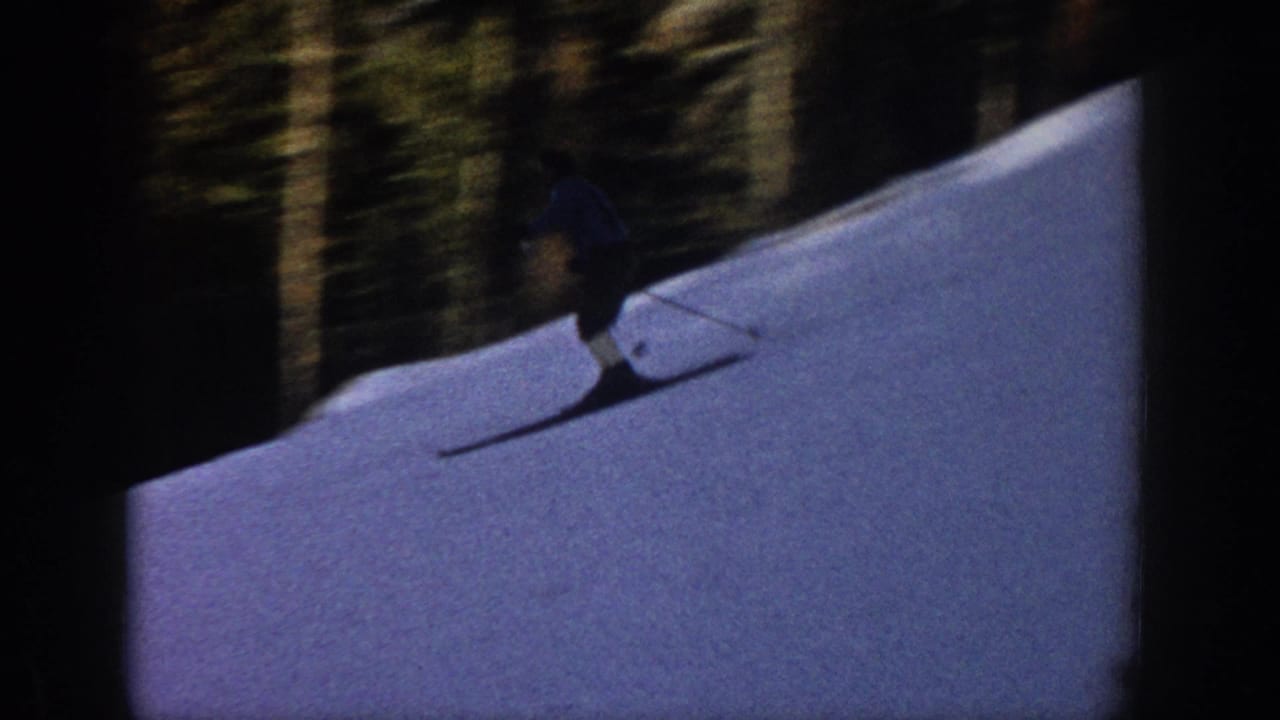 A skier in dark clothing moves across a snow-covered slope in Aspen, Colorado, in 1961 home-movie footage.