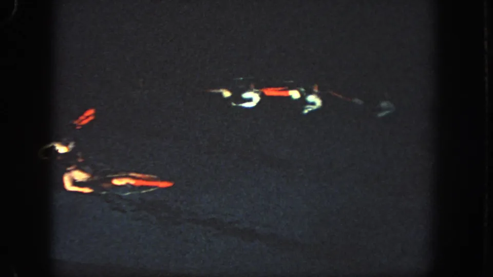 The closing 1951 Atlanta frame shows swimmers separated in dark water, with only suits and reflections clearly visible.