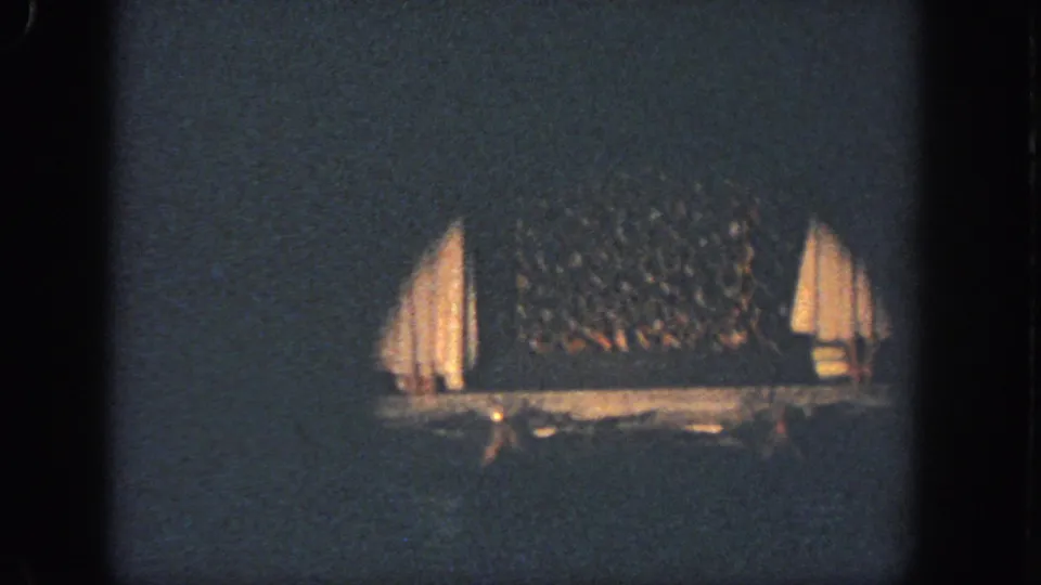 The final frame shows the dim stage area after the performers leave or drop from view, with curtains and backdrop still visible.