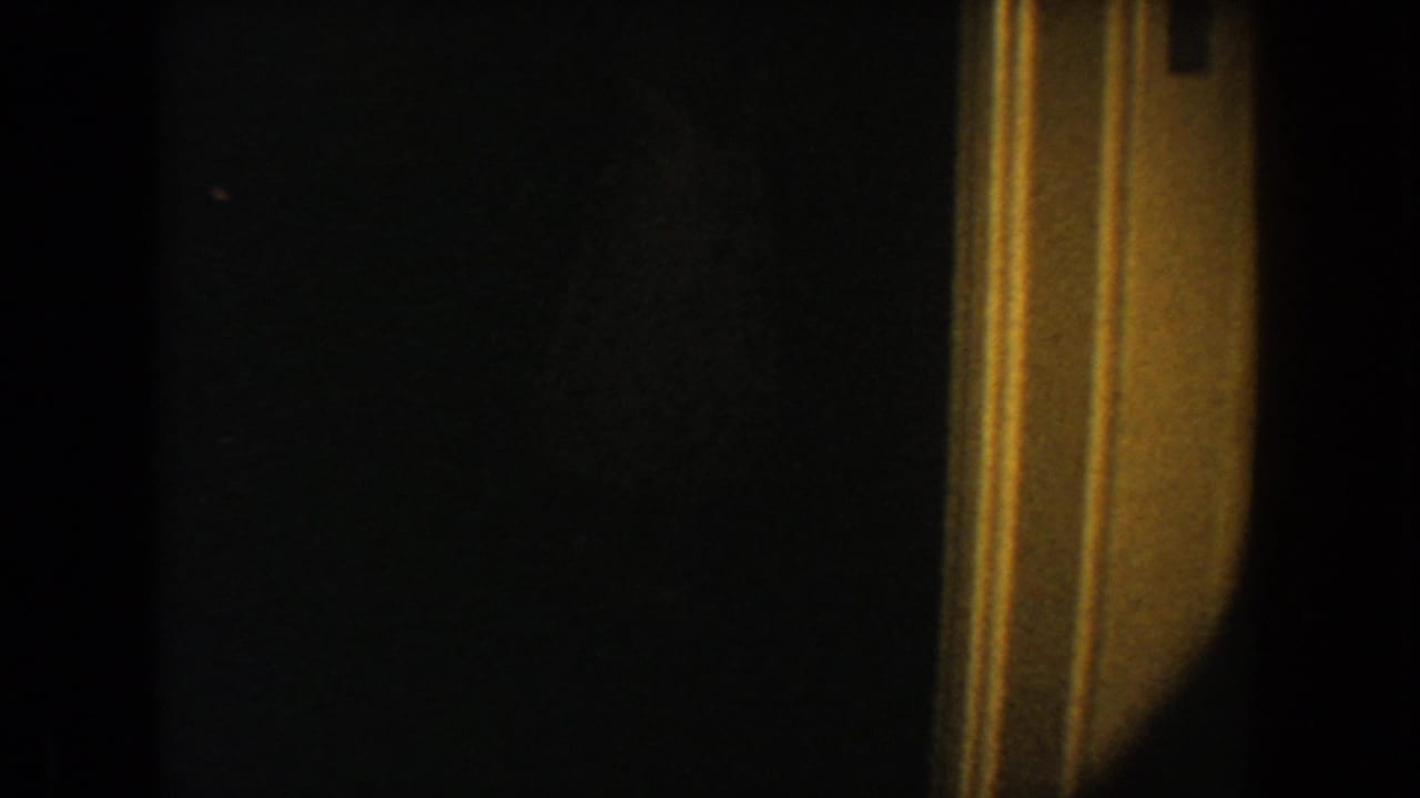 Mostly black frame with a narrow warm vertical edge on the right.