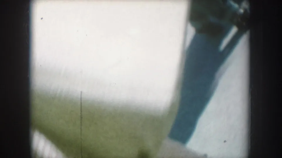 Abstract close-up of a boat hull or bow, likely filmed at a South Dakota lake during the same family vacation as the preceding street footage.