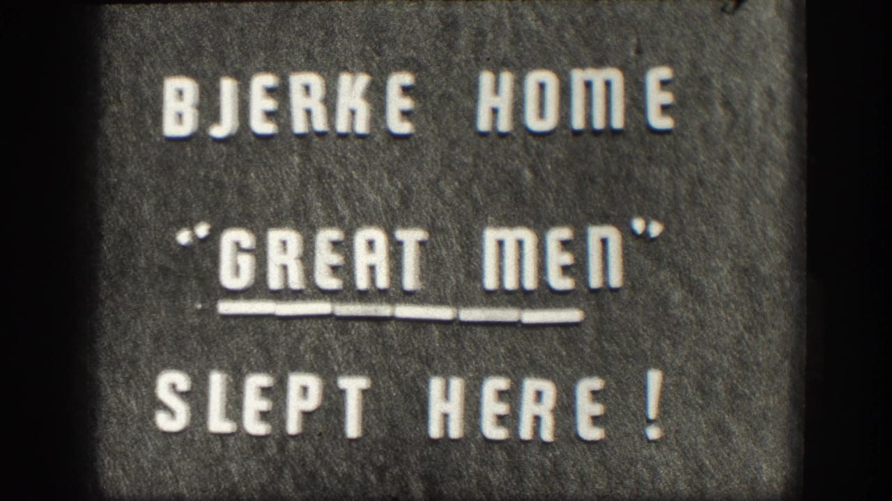 1950s 8mm home movie intertitle: white press-type letters on a dark felt-like board reading BJERKE HOME / 'GREAT MEN' / SLEPT HERE!, Kansas, USA.