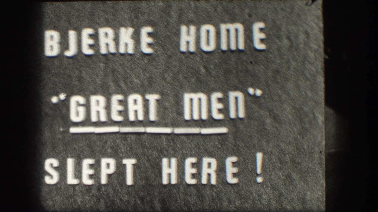 Held 8mm intertitle frame: white press-type letters on dark felt-like board reading BJERKE HOME / 'GREAT MEN' / SLEPT HERE!, mid-century Kansas home movie.