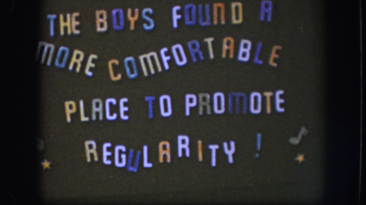 Multicolored home-movie title card with playful all-caps text and decorative musical notes and stars on a dark background.