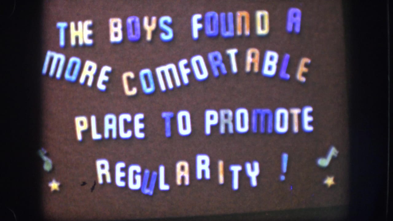 1958 home-movie title card with playful multi-colored stencil lettering and decorative stars on a dark brown background, typical of amateur 8mm filmmaking.