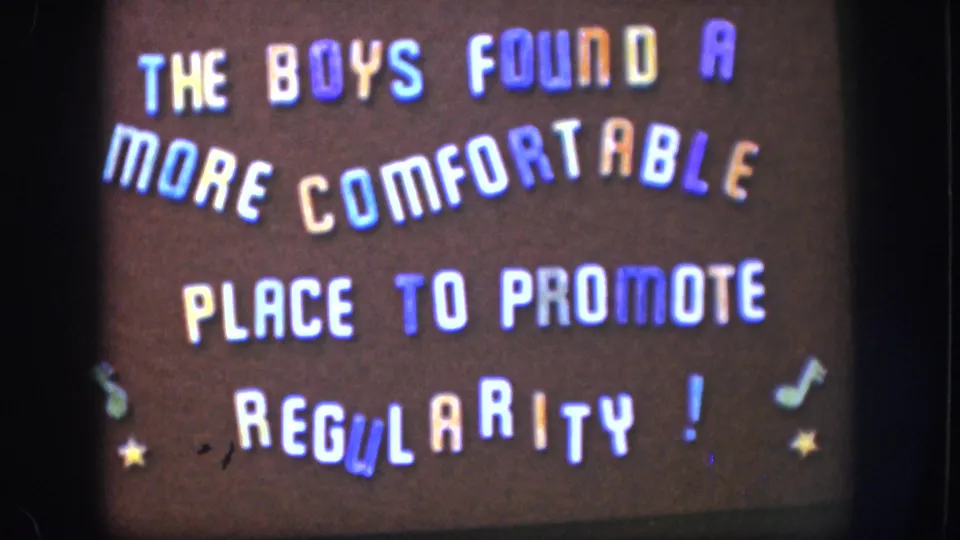 1958 home-movie title card with playful multi-colored stencil lettering and decorative stars on a dark brown background, typical of amateur 8mm filmmaking.