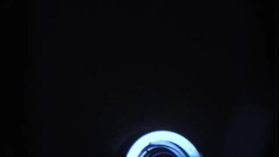 The final 1958 Nebraska frame appears to shift into a very dark barn or stable view, where faint figures are barely visible around a bright circular object.