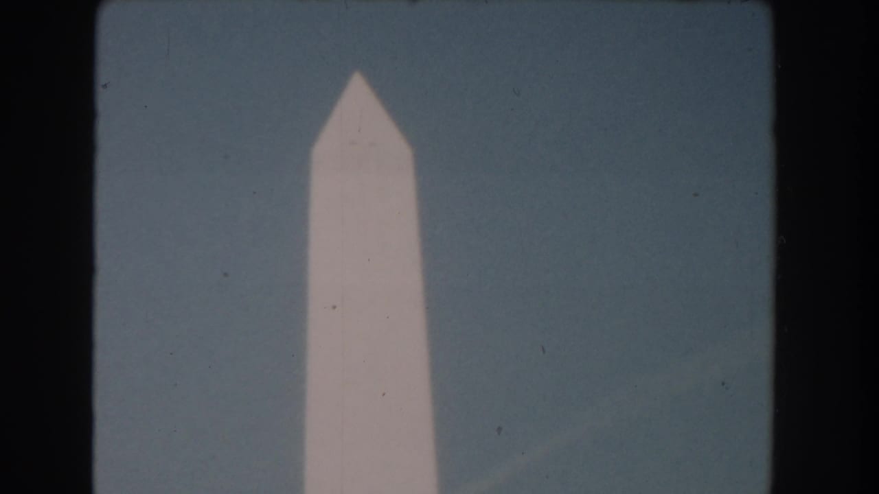 Washington Monument against a pale sky with dark 8mm frame edges.