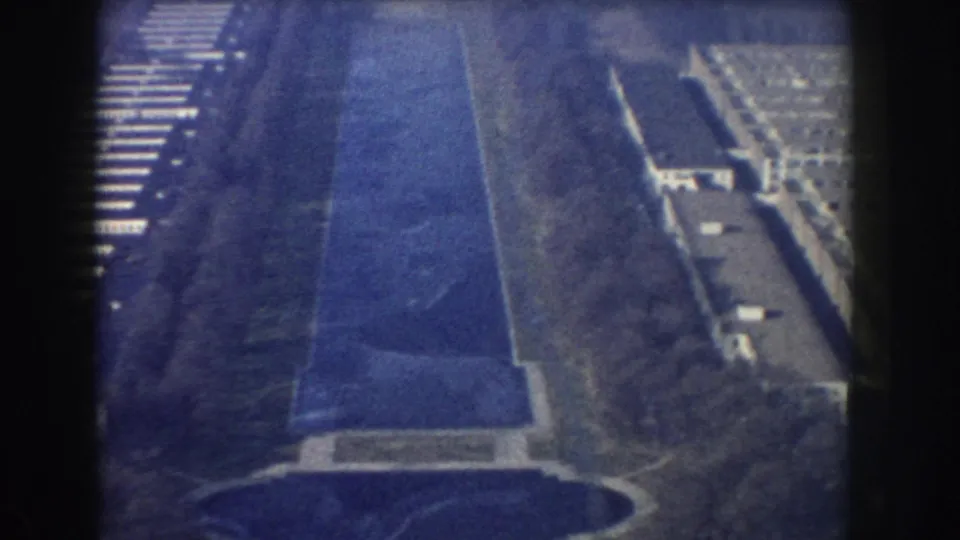 1960 Washington, DC aerial view looking along the Reflecting Pool with formal lawns and surrounding roads.